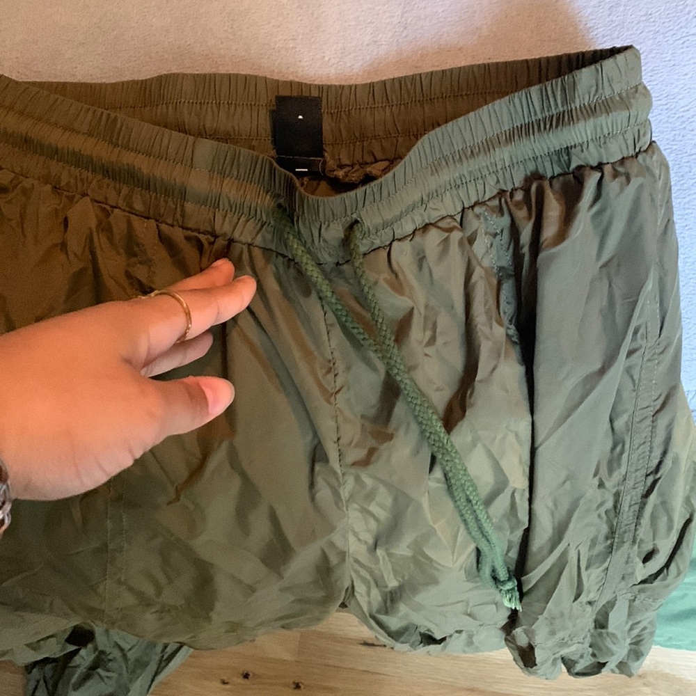 Earthy green parachute pants